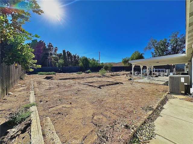 view of yard featuring cooling unit and a patio