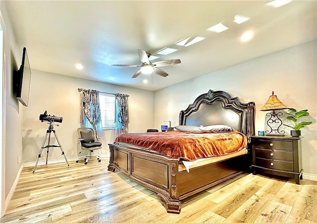 bedroom with ceiling fan and light wood-type flooring