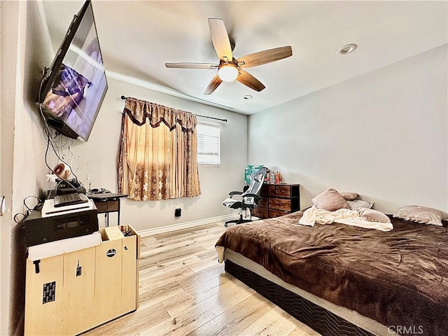 bedroom featuring ceiling fan and light hardwood / wood-style flooring