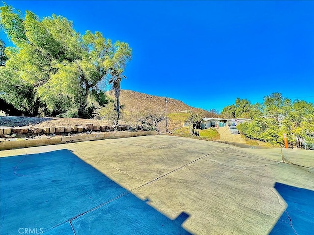 view of swimming pool featuring a mountain view