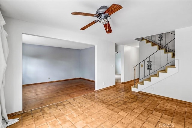 unfurnished living room with ceiling fan and light hardwood / wood-style flooring