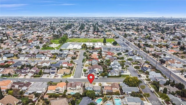 birds eye view of property with a residential view