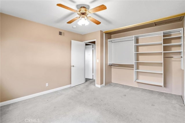 unfurnished bedroom featuring light colored carpet and ceiling fan