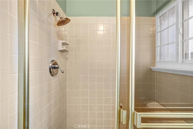 bathroom featuring an enclosed shower