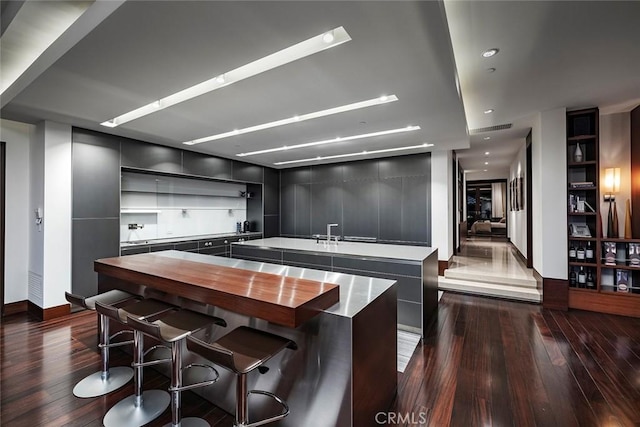 kitchen featuring dark wood-type flooring and a kitchen island