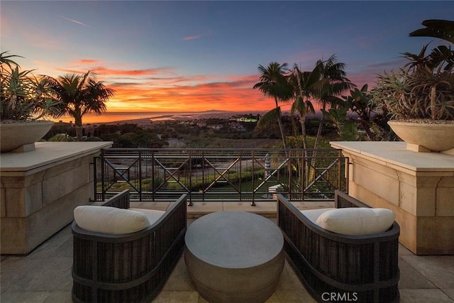 view of patio terrace at dusk