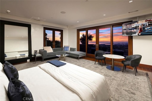 bedroom featuring access to exterior and french doors