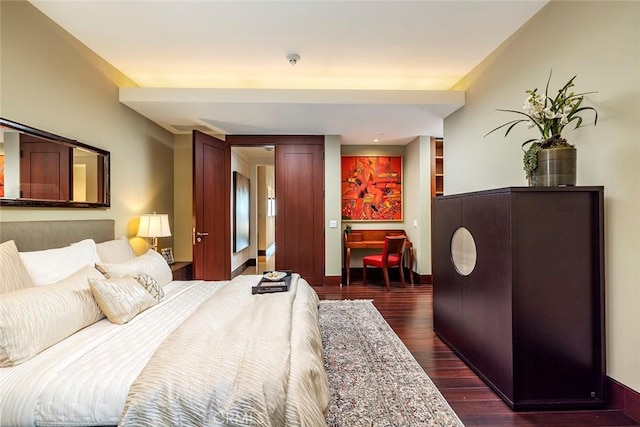 bedroom featuring dark wood-type flooring