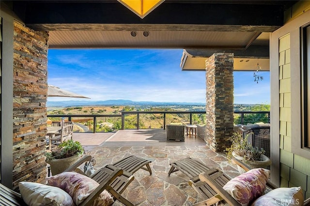 view of patio / terrace featuring a balcony and a mountain view