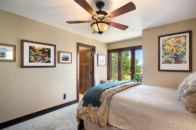 bedroom with ceiling fan and carpet