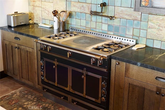 kitchen featuring decorative backsplash and cooktop