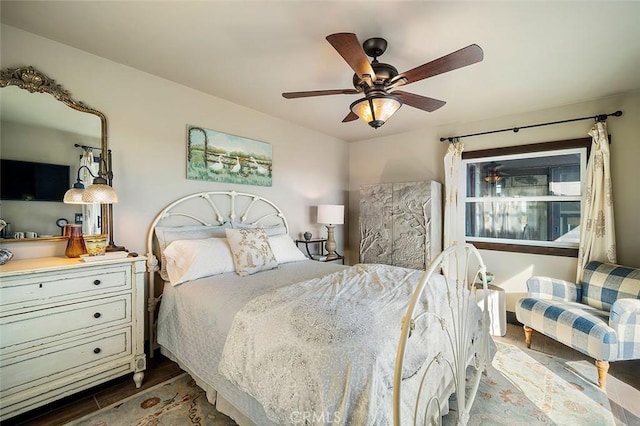 bedroom featuring ceiling fan and wood-type flooring