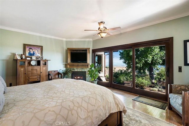 bedroom with ceiling fan, access to exterior, ornamental molding, and light hardwood / wood-style floors