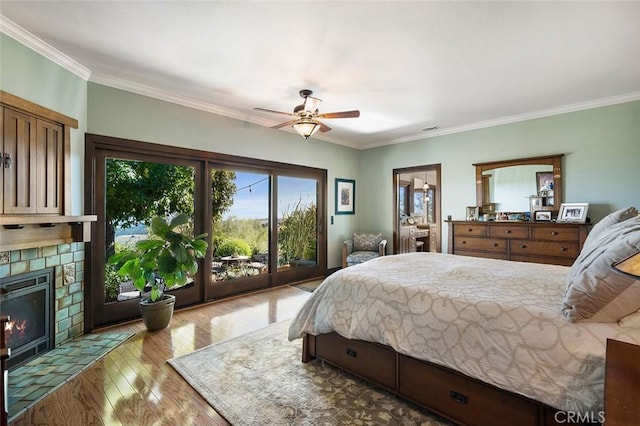 bedroom featuring ceiling fan, access to outside, crown molding, and light hardwood / wood-style flooring