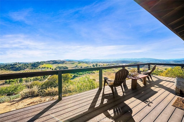 wooden deck featuring a mountain view