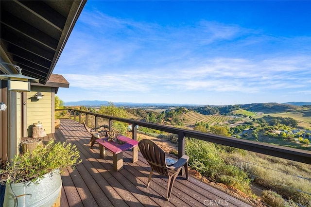 wooden deck with a mountain view