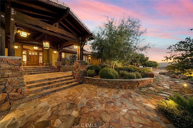 view of patio terrace at dusk