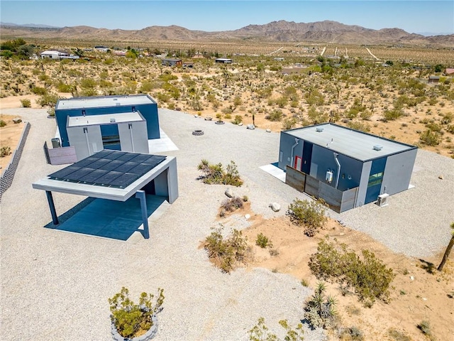 birds eye view of property featuring a mountain view