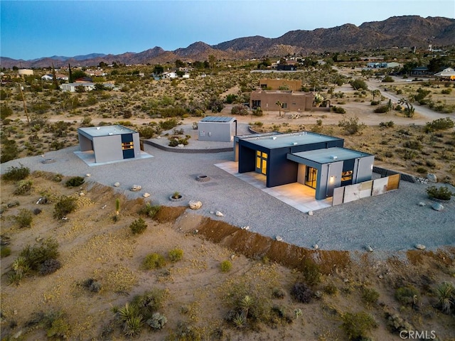 birds eye view of property with a mountain view