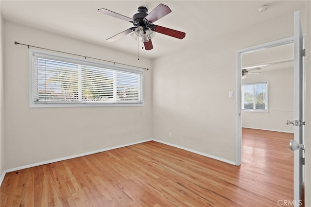 unfurnished room featuring ceiling fan and light hardwood / wood-style floors