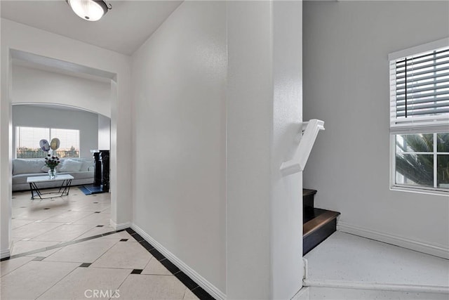 staircase with tile patterned floors