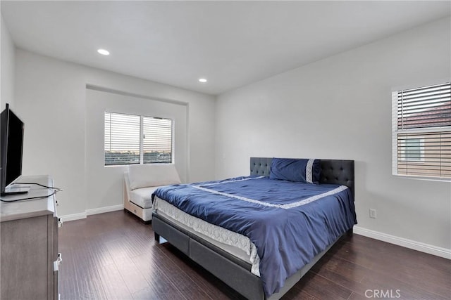 bedroom with dark wood-type flooring