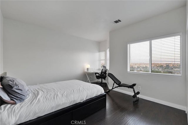 bedroom featuring dark hardwood / wood-style floors