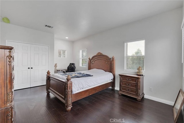 bedroom featuring a closet and dark hardwood / wood-style floors