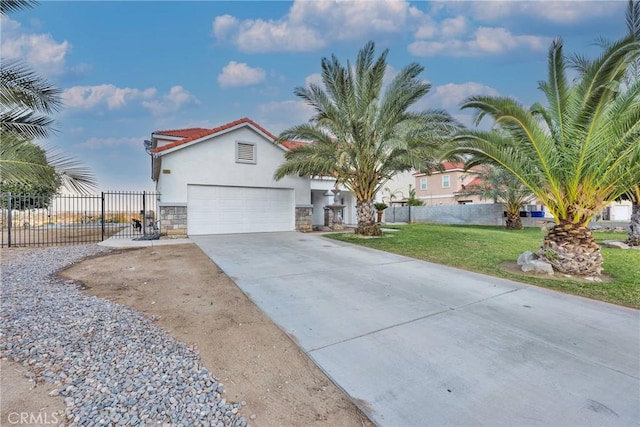 view of front of house with a front lawn and a garage