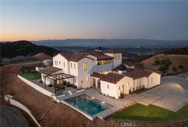 exterior space with a patio area, a gazebo, a mountain view, and a pergola