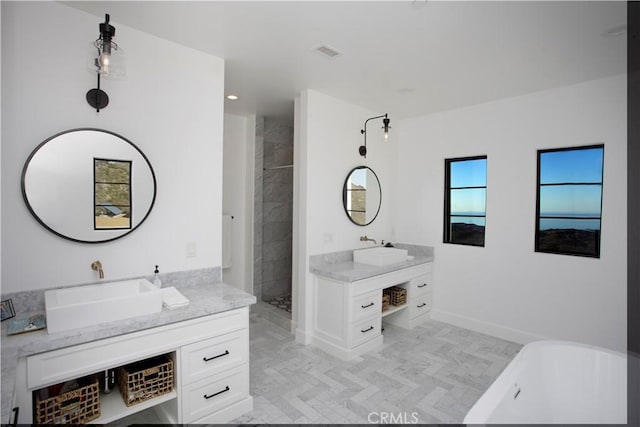 bathroom with separate shower and tub and vanity