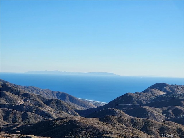 view of mountain feature featuring a water view