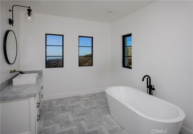 bathroom featuring a bathtub and vanity