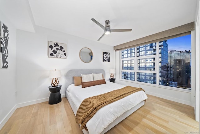 bedroom featuring light wood-type flooring and ceiling fan