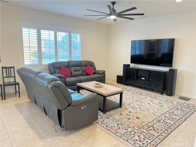 tiled living room featuring ceiling fan