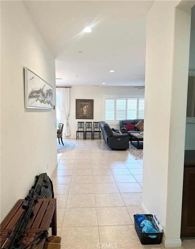 hall with light tile patterned floors