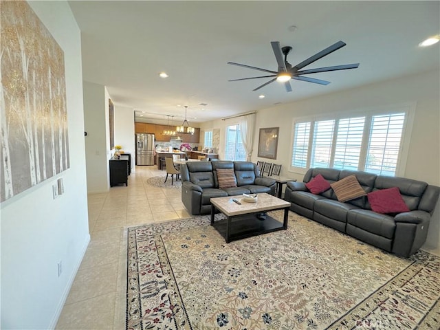 tiled living room with ceiling fan