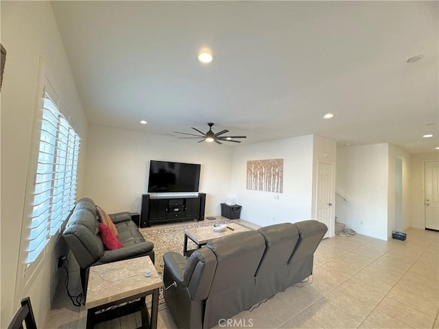 tiled living room with ceiling fan