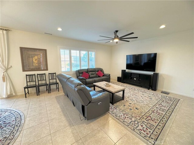 living room with ceiling fan and light tile patterned floors