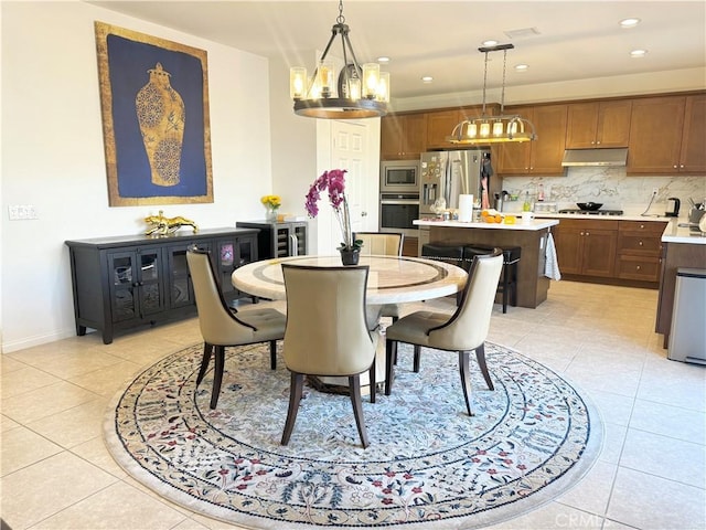 dining area featuring light tile patterned flooring