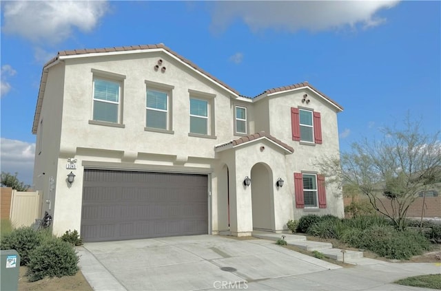 mediterranean / spanish-style home featuring a garage