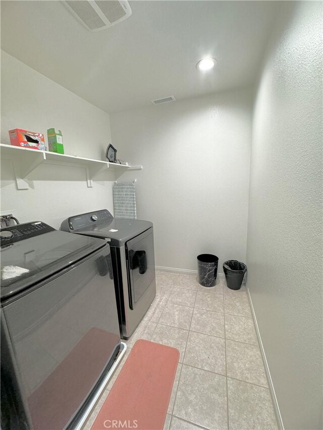 washroom featuring washer and clothes dryer