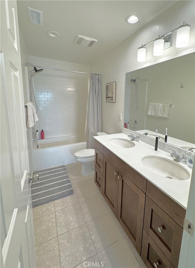 full bathroom featuring toilet, vanity, shower / bath combo, and tile patterned flooring