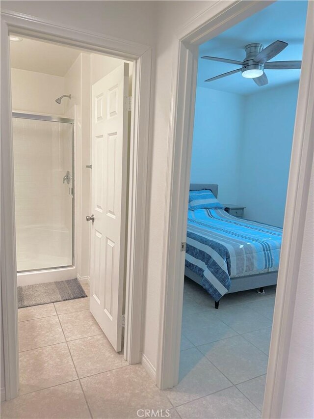 tiled bedroom with ceiling fan