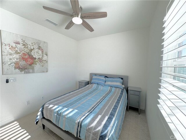 bedroom featuring ceiling fan and light tile patterned floors