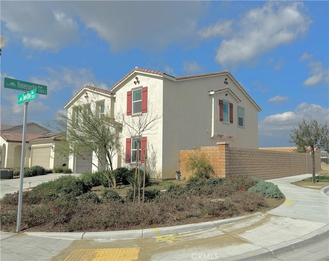 view of side of property featuring a garage