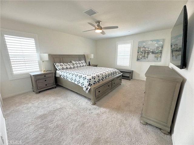 bedroom featuring ceiling fan and light carpet