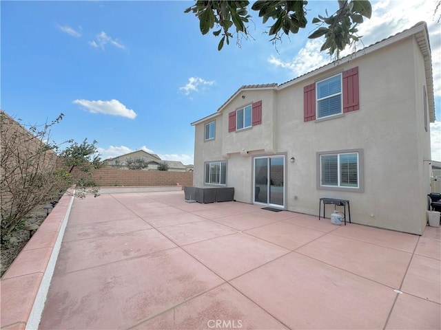 back of property with a patio area