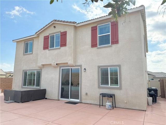 back of property with a patio area