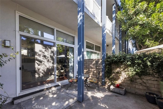 entrance to property featuring a patio area